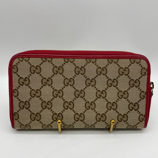 SOLD! Gucci Canvas Long Zippy Wallet